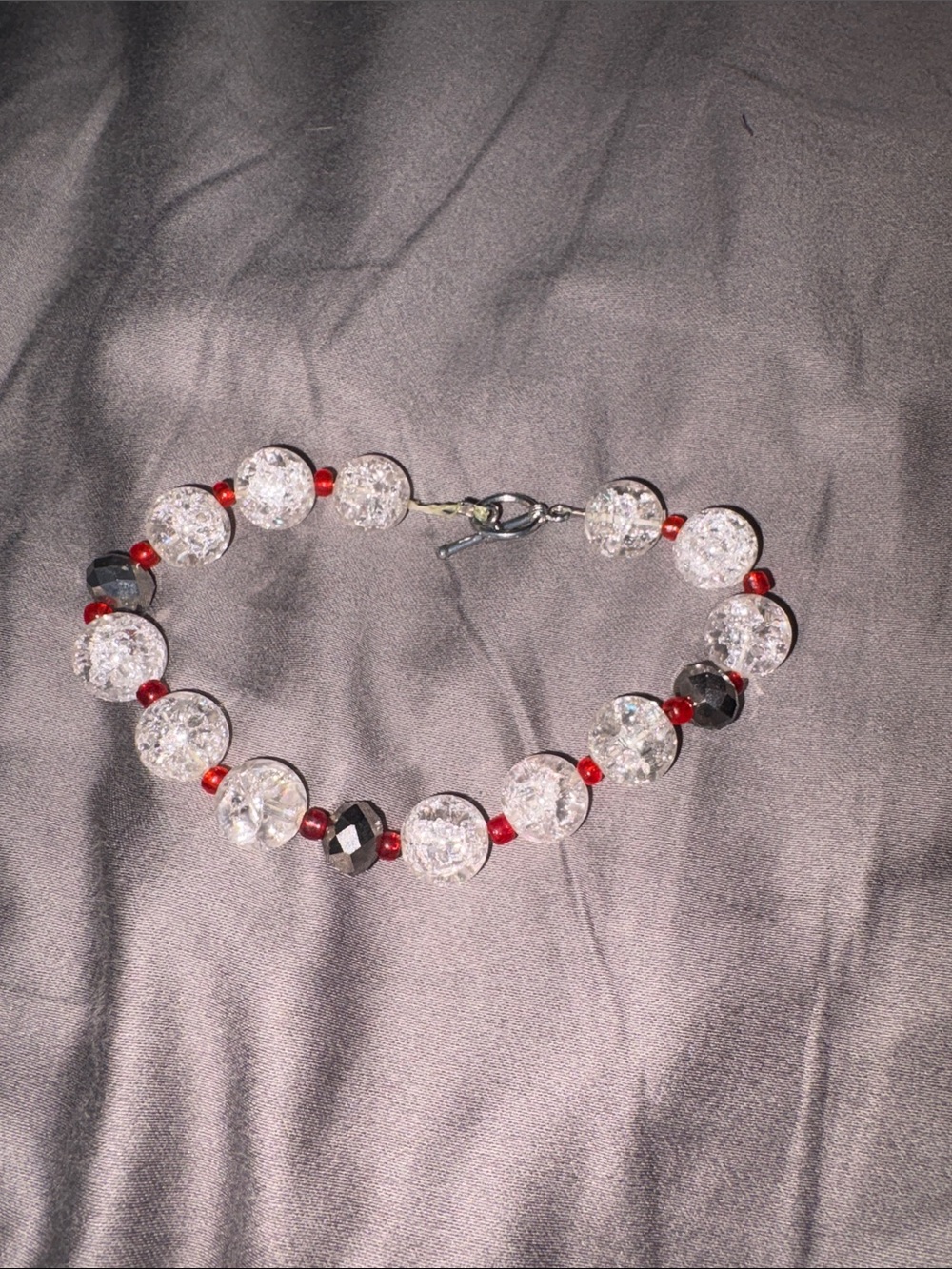 Crystal and Red Bead Bracelet with Faceted Black Accents